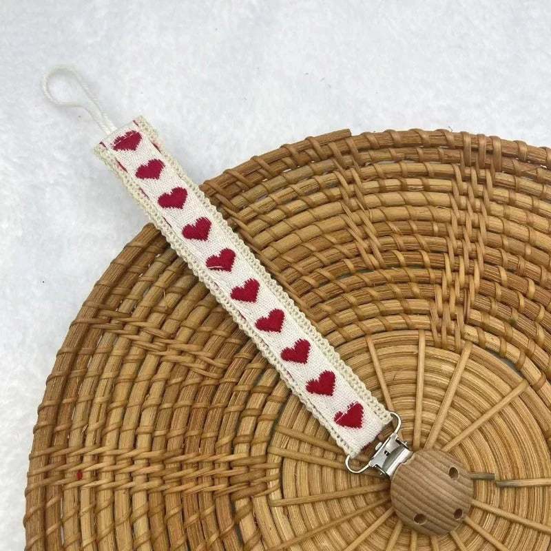 Attache tetine accessoire pratique rouge