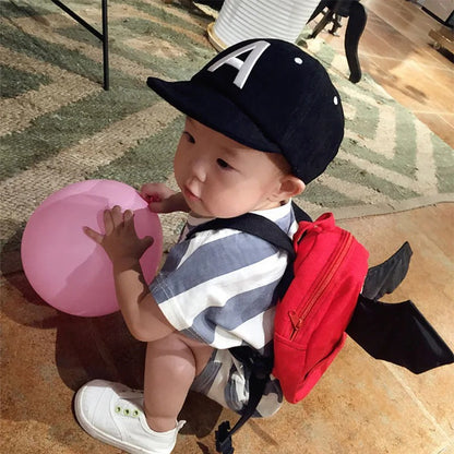 Casquette bebe confort ultime bebe avec son sac au dos
