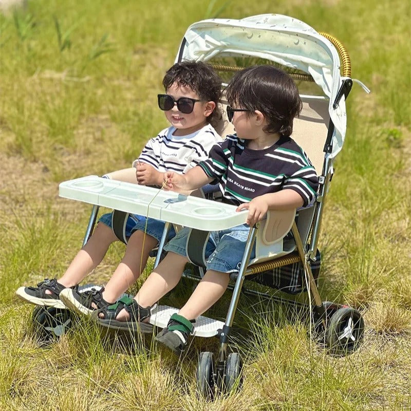 Poussette bebe jumeaux compacte bebes en exterieur