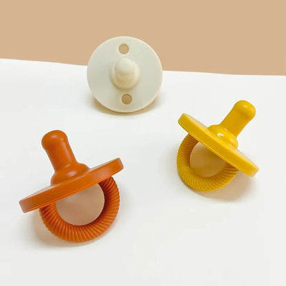Tétine bebe silicone sans BPA couleurs vives