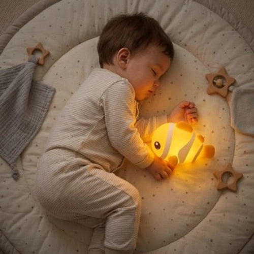 Veilleuse bebe dort pres de la veilleuse