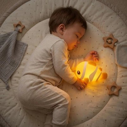 Veilleuse bebe dort pres de la veilleuse